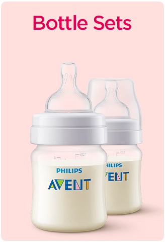 Philips Avent baby bottles filled with milk.