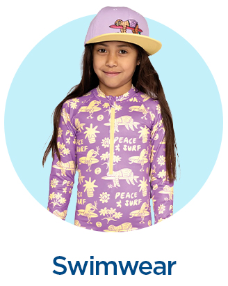 Girl wearing a purple long-sleeve swimsuit and pink cap with playful patterns.